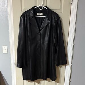 Jones New York A line Black Leather Jacket. Hits at approximately mid thigh.